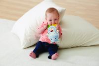 Vtech Little Friendlies Happy Hippo Teether Blue baby on pillows with teether